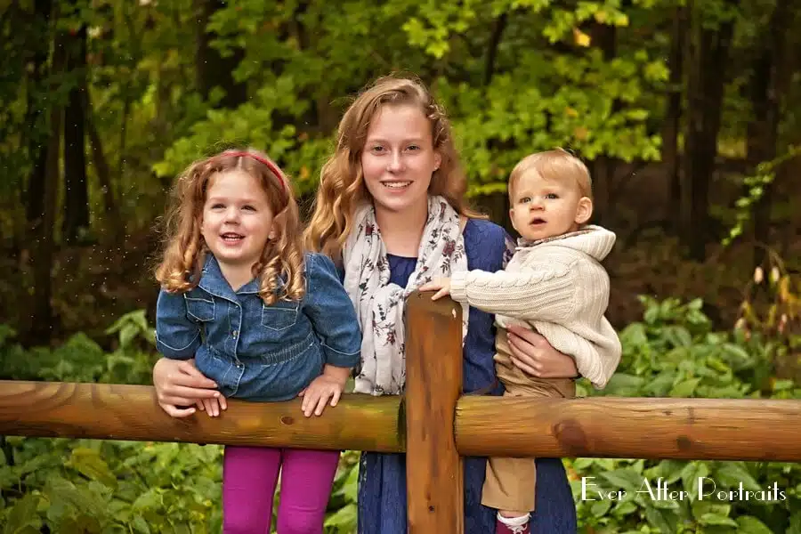 Three siblings in outdoor portrait.